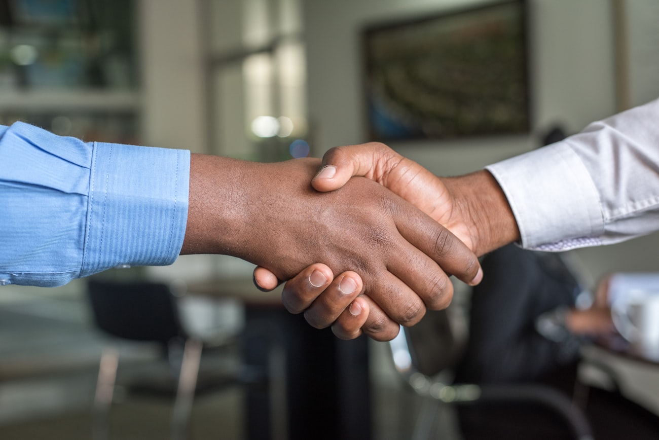 A self-employed professional reviewing finances with an adviser