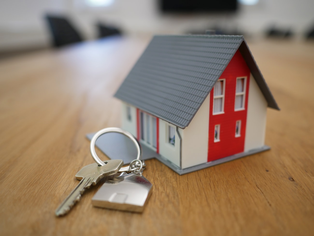 A first-time buyer couple outside their new UK home